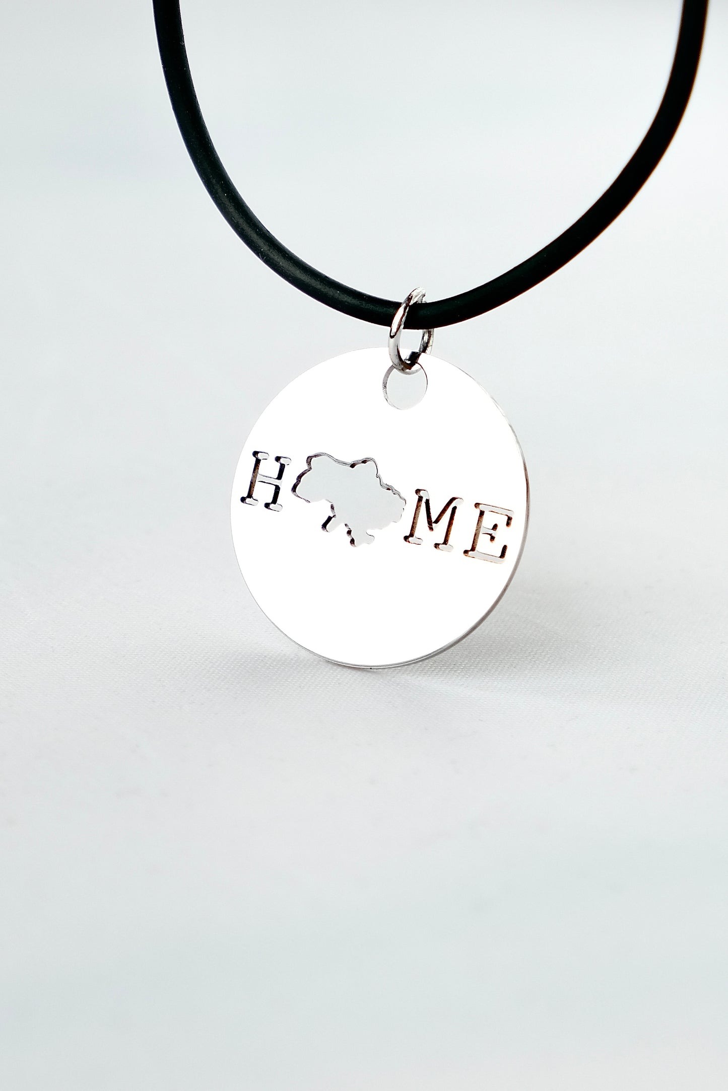Pendant with "Home" cutout